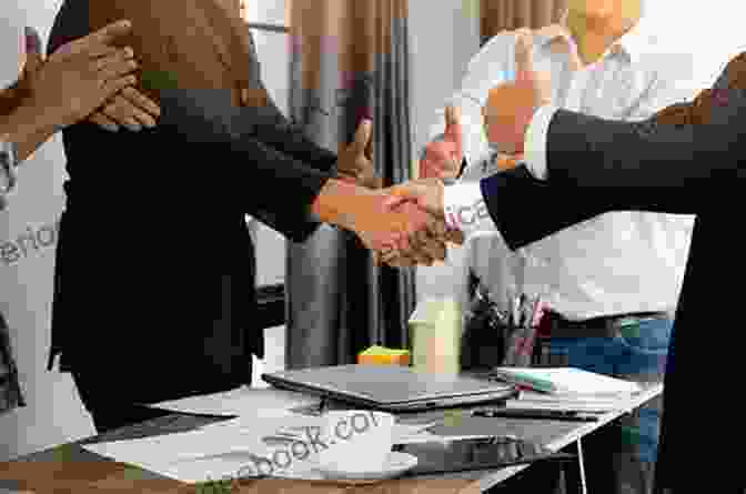 A Group Of People Shaking Hands After A Successful Deal Negotiation M A: A Practical Guide To ng The Deal (Wiley Finance)