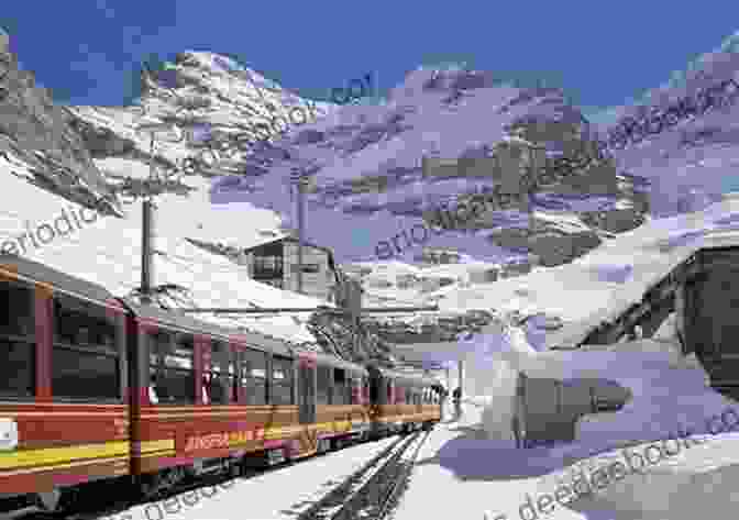 Aerial View Of The Jungfraujoch Railway Station, Perched Atop A Snow Covered Mountain. The Swiss Flag Can Be Seen Fluttering In The Wind. High Horizons In Switzerland Part 2: Travelling In Switzerland
